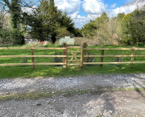 Wooden driveway fencing with gate