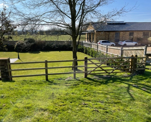 Wooden field fencing with gate